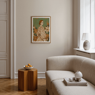 Floral Girl Illustration print on a living room wall with muted colours and a wooden side table with a bowl of oranges