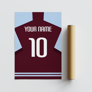 Custom football shirt print in claret with light blue sleeves next to a brown packaging tube