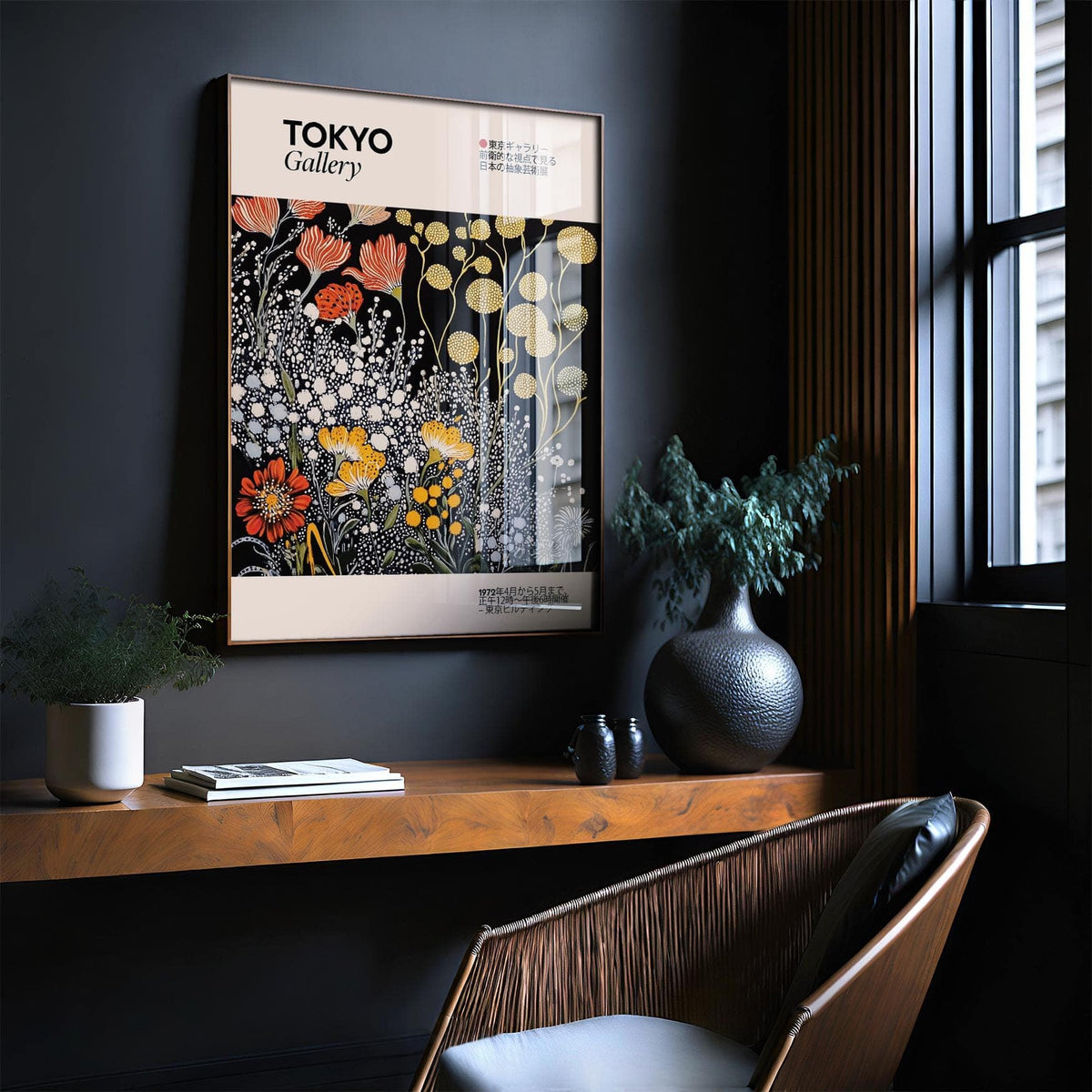 Vintage Japanese wall art of stylized flowers in red yellow and white framed on a dark wall above a wooden shelf