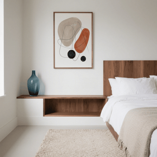 Abstract Shapes Art Print on a bedroom wall with red brown, beige and black shapes above a floating wood shelf with blue vase