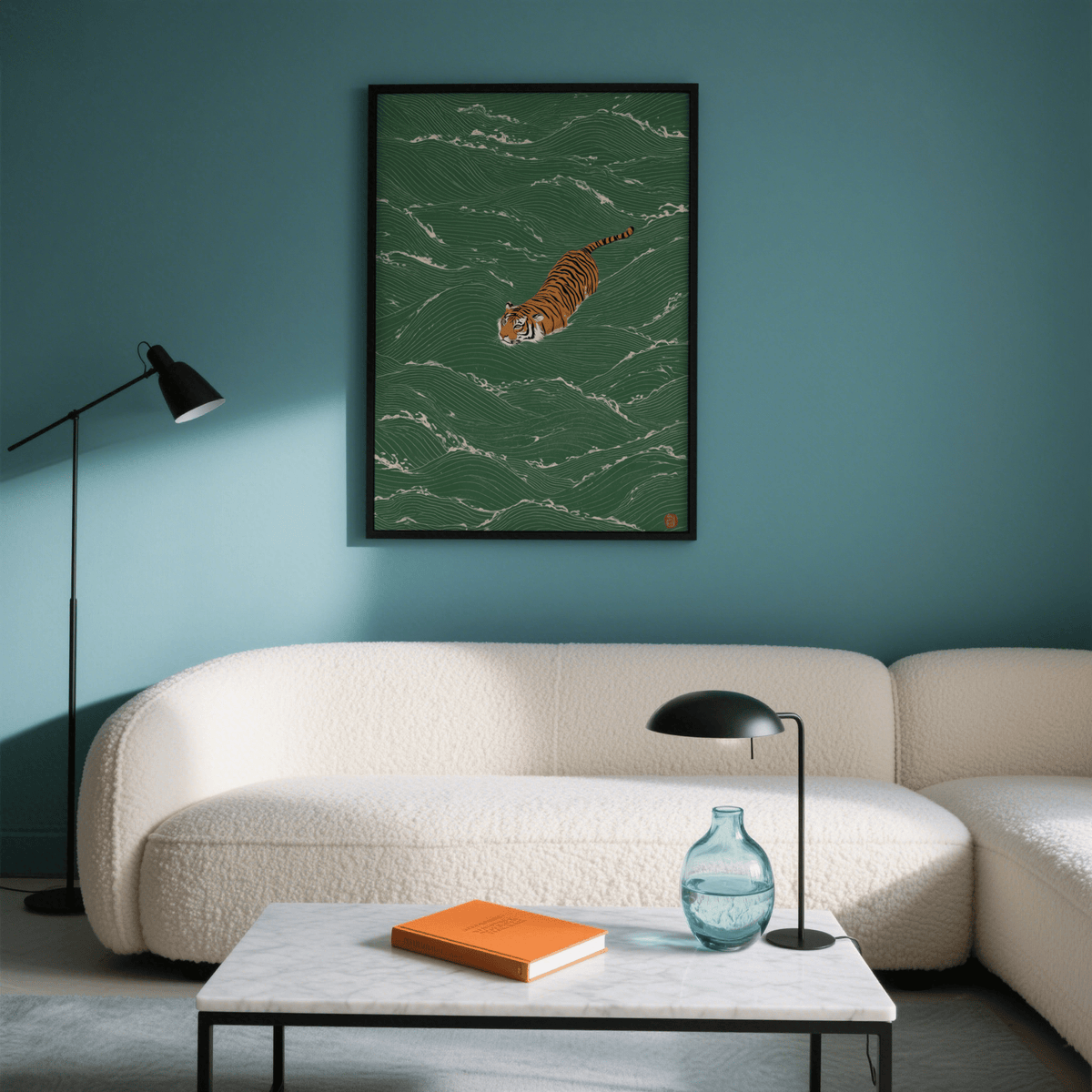 Wildlife wall decor of a swimming tiger with green waves above a beige sofa