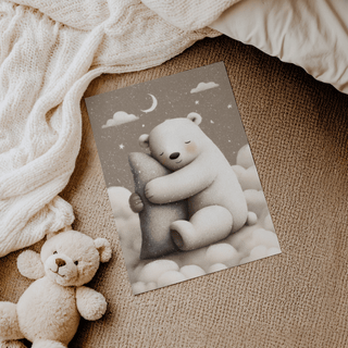 Polar Bear Nursery Print on the floor with a knitted blanket and teddy bear nearby in neutral tones