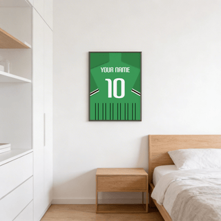 Football Shirt Poster in Green with Black and White Sleeve Stripes hanging on a white wall above a wooden bedside table