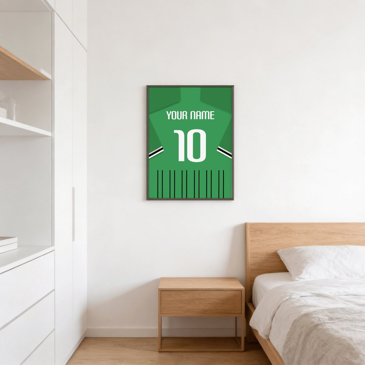 Football Shirt Poster in Green with Black and White Sleeve Stripes hanging on a white wall above a wooden bedside table