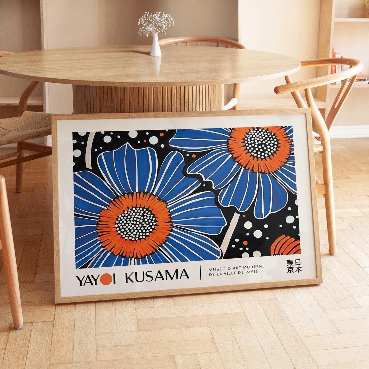 Unique Flower Art print leaning on a wooden floor with a dining table and vase behind