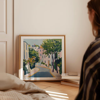 Notting Hill poster leaning on floor by books with pastel colours and a tree