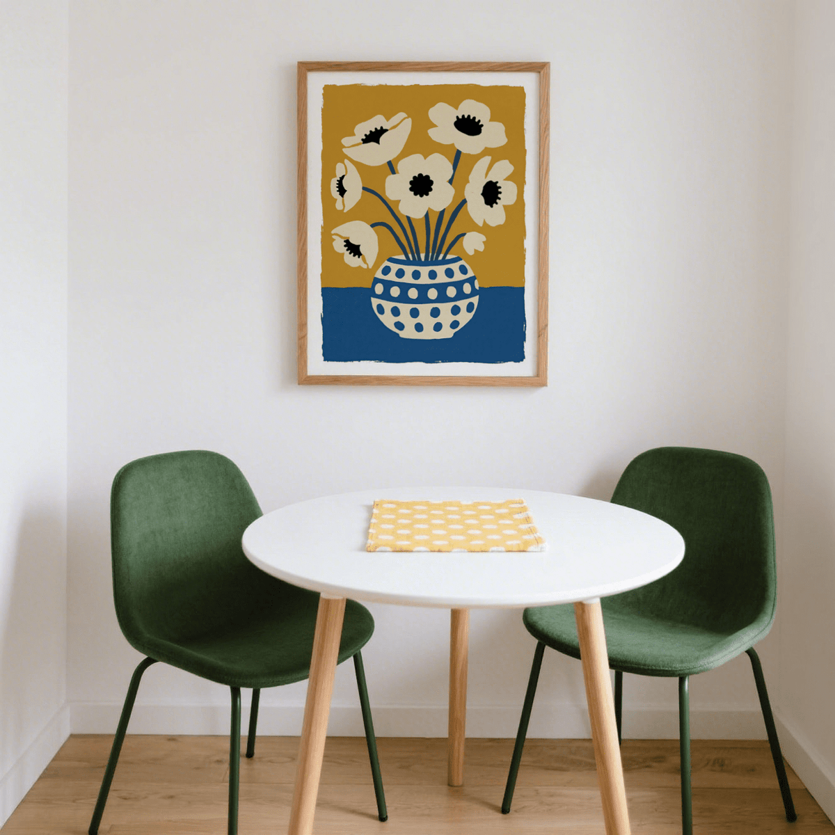 Flower art print of cream anemone flowers in a blue and white spotted vase above a white dining table