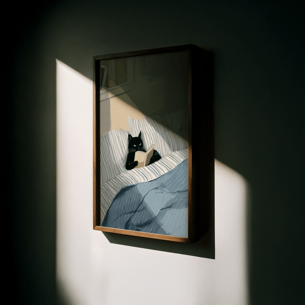 Framed Cat Reading Book wall art of a black cat in bed with blue and white bedding in shadow