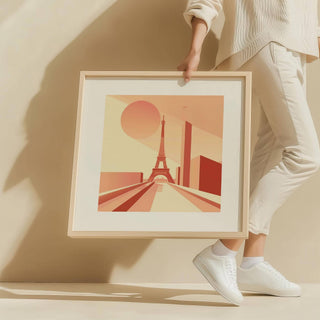 Framed Eiffel Tower poster wall art with minimalist bauhaus style held by person wearing white