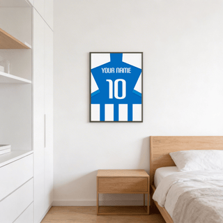 Football Shirt Poster in Blue and White Stripes with Striped Sleeves on a bedroom wall above a wooden bedside table