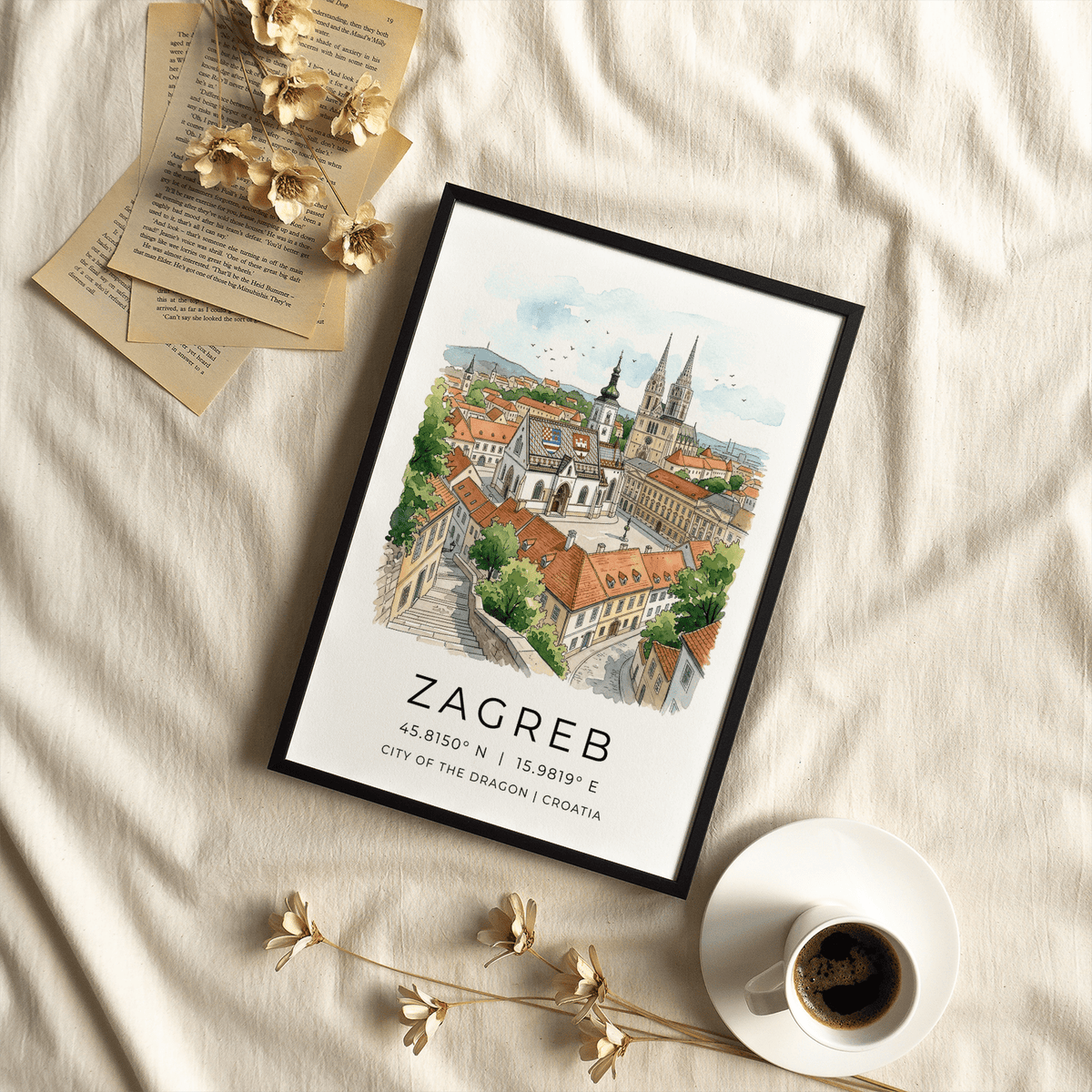 Zagreb City Art Print in a black frame with dried flowers and coffee cup on a fabric surface