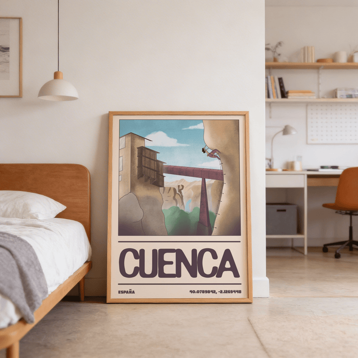 Rock climbing poster showing a climber on a cliff with a bridge in the background leaning in a bedroom with a bed nearby