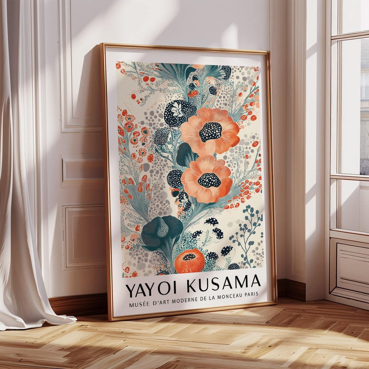 Print leaning on floor of floral poster wall art with orange and blue stylised blooms in a bright room