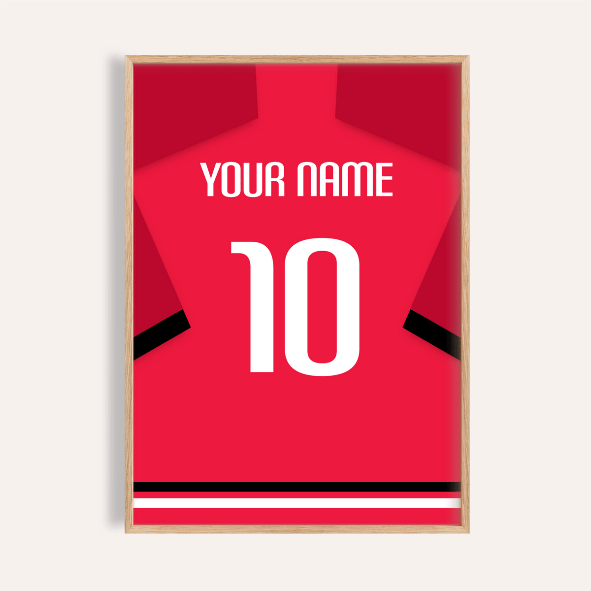 Framed print close-up of a red football shirt with black sleeve stripes and a white number 10