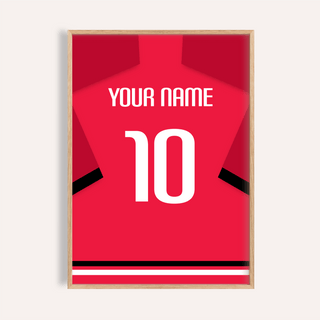 Framed print close-up of a red football shirt with black sleeve stripes and a white number 10