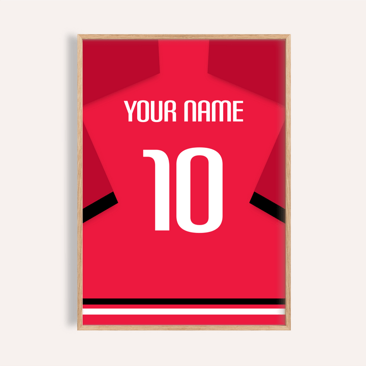 Framed print close-up of a red football shirt with black sleeve stripes and a white number 10