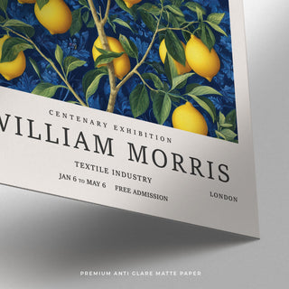 Detail close-up of lemon wall art for kitchen showing bright yellow lemons and green leaves on a dark blue background