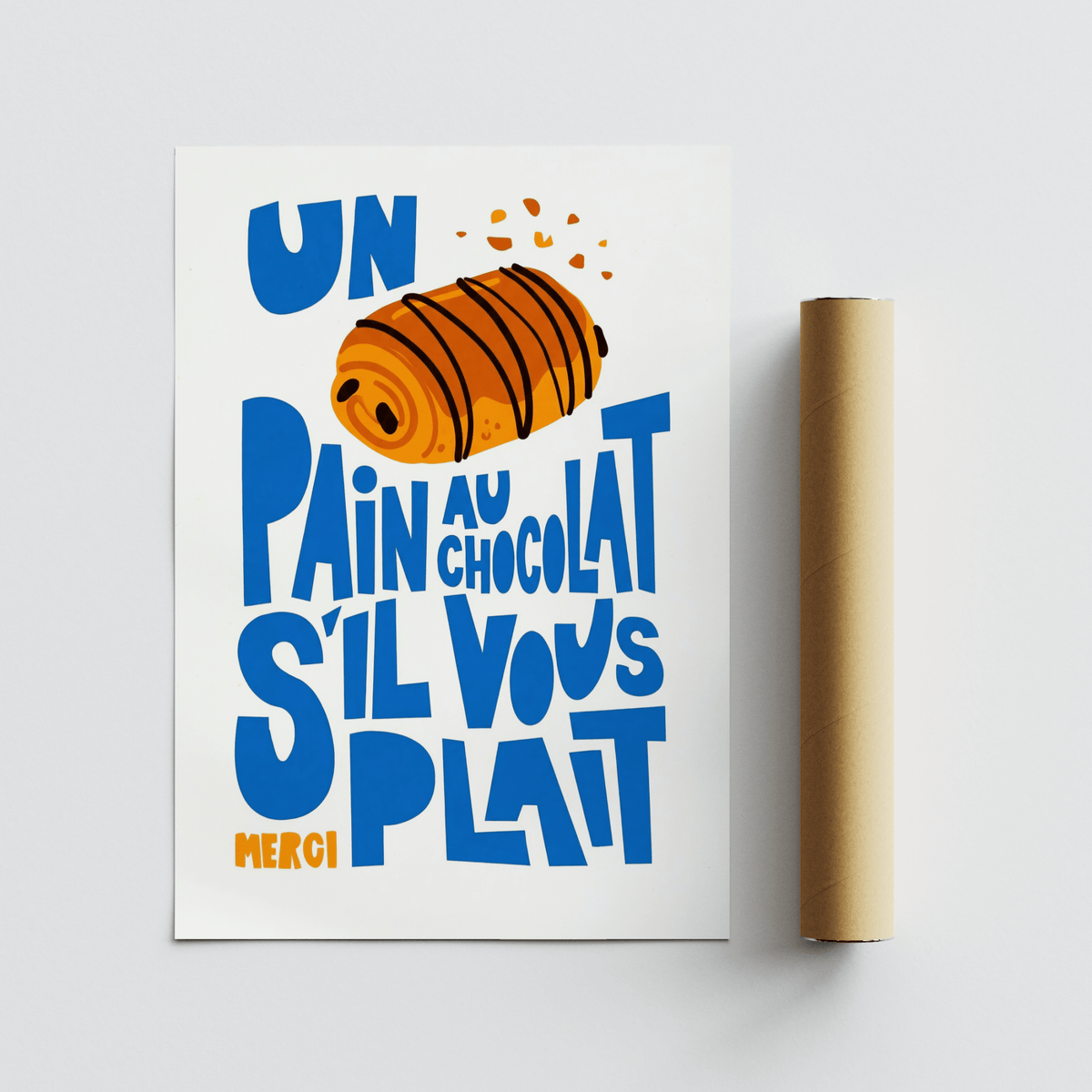 Pain Au Chocolat Print flat on surface next to a brown packaging tube