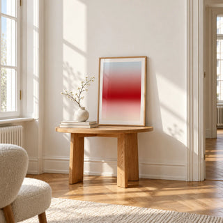 Cherry Glow Print, a small A4 framed print leaning on a small solid oak side table