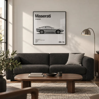 Classic 1970s Grand Tourer Poster, framed on the wall of a design-led living room in a UK city flat with a soft white wall
