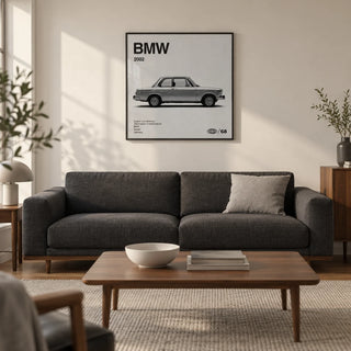 Classic 1970s Sports Saloon Poster, framed on the wall of a restrained modern living room in a UK city flat with a warm white wall