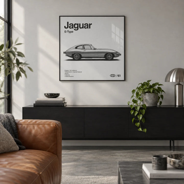 Classic British Sports Car Poster, framed on the wall of a design-led city flat living room with a pale grey wall and a polished concrete floor