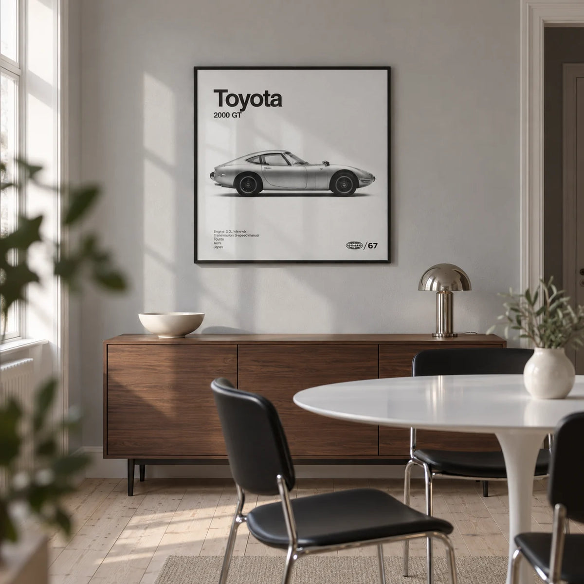 Classic Japanese Sports Car Poster, framed on the wall of a compact modern dining room in a UK flat with a soft grey wall and pale timber flooring