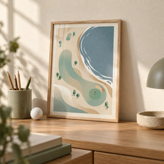 Coastal Golf Course Art Print, a small A4 framed print leaning on a pale oak desk