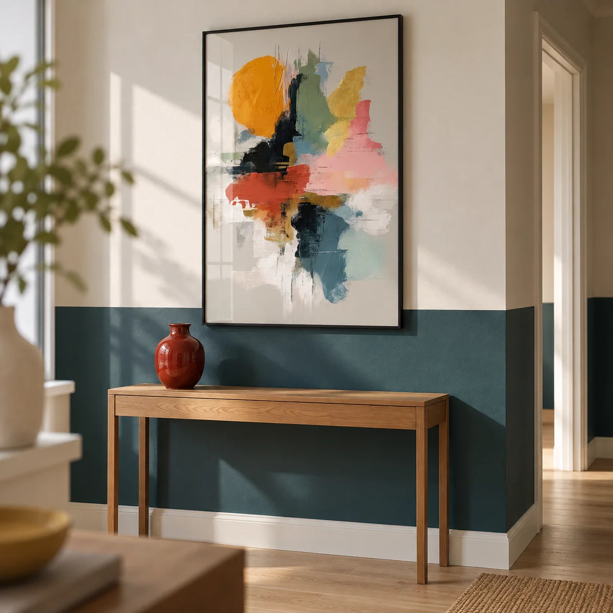 Colorful Abstract Art Print, framed on the wall of a modern hallway with a deep teal painted lower wall and warm white above