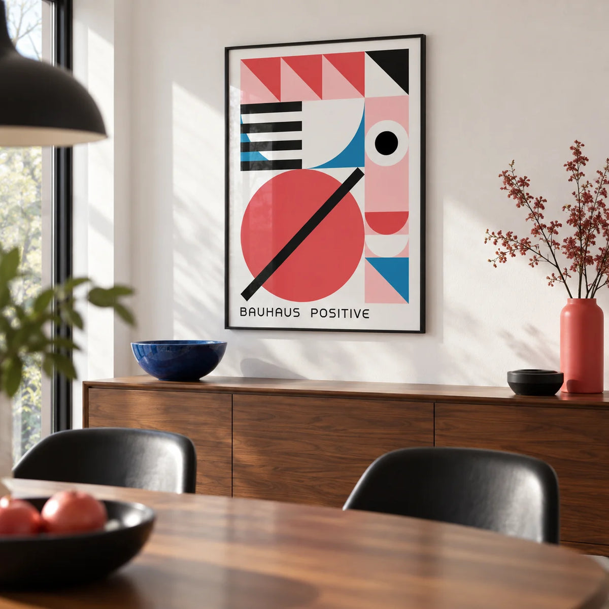 Colorful Geometric Art, framed on the wall of a modern dining room with a white wall