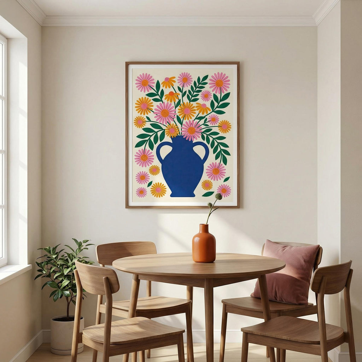 Vase art print of minimalist floral vase with orange and pink flowers above dining table with terracotta vase