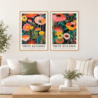 Colourful Floral Prints Set of 2 hung at eye level above a white linen sofa: Petal Paradise and Botanical Glow shown framed side by side (frames not included)