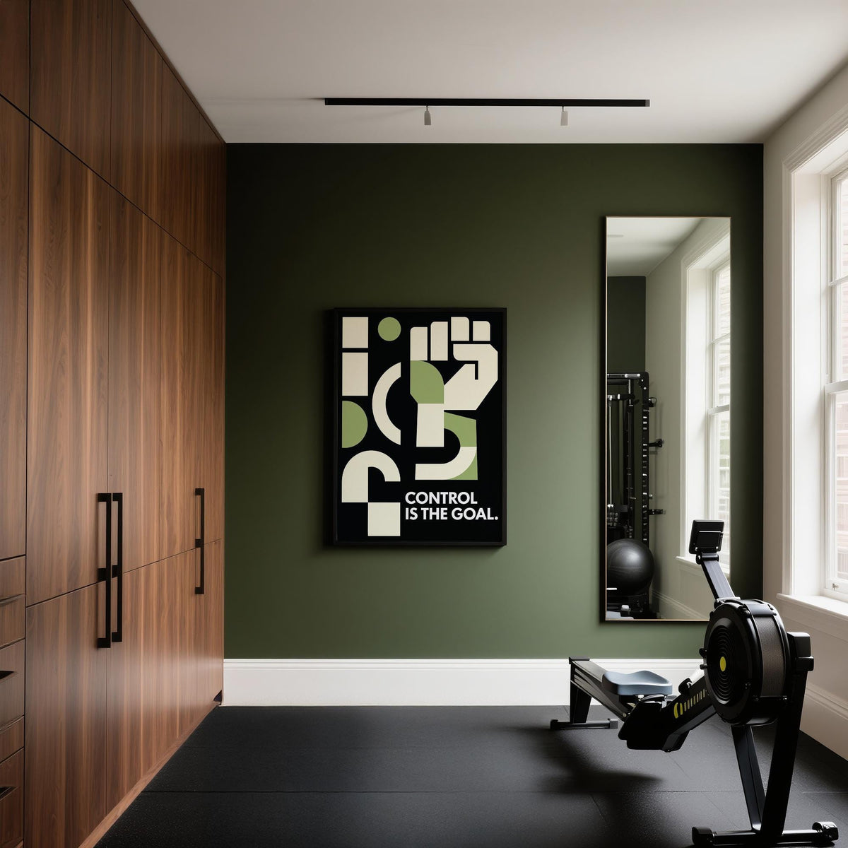 Fitness motivation poster with abstract raised fist in green and cream on a dark wall in a gym with rowing machine