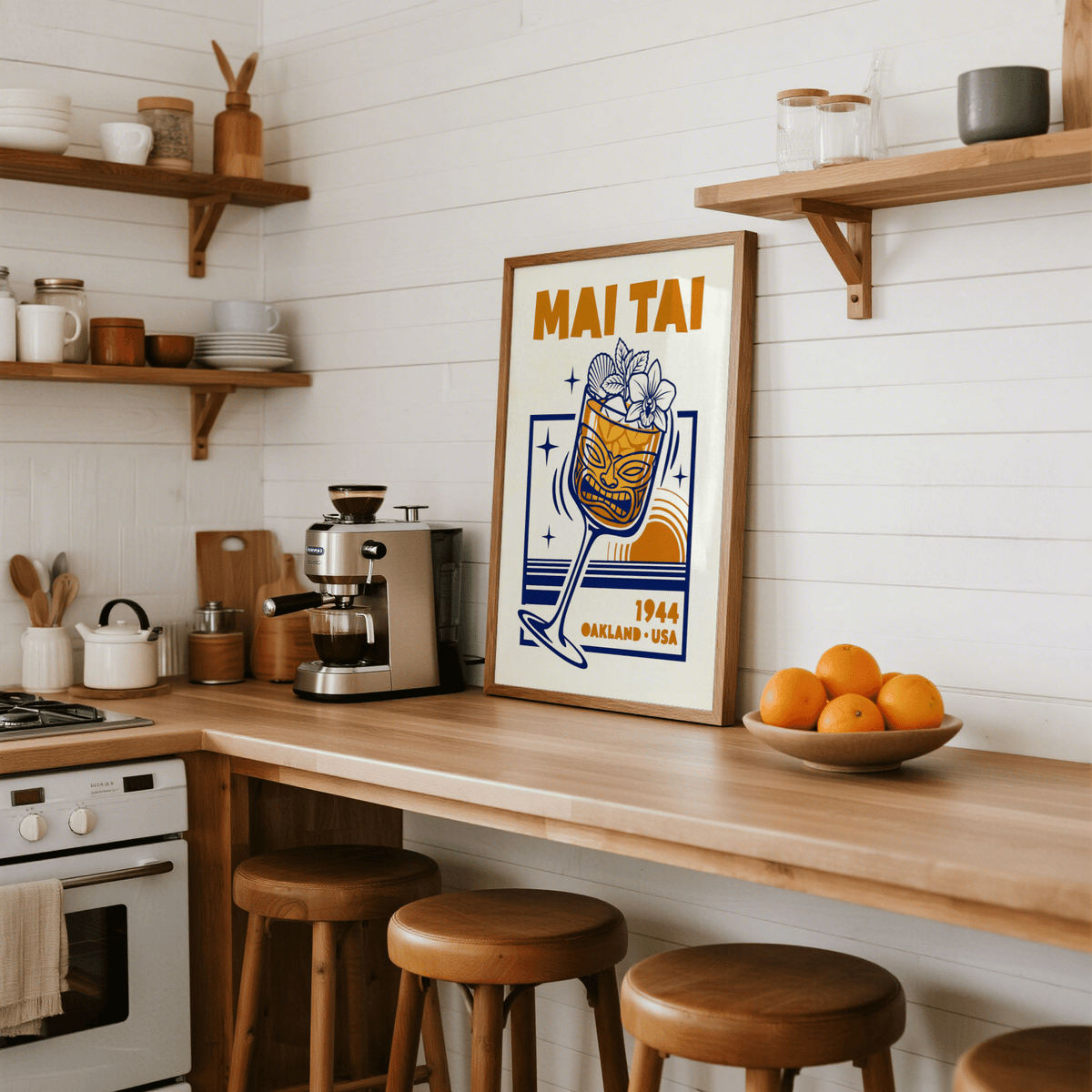 Print leaning on a kitchen counter of Mai Tai wall art with golden and navy illustration and text