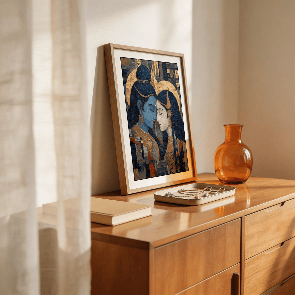 Pic Of Shiva And Parvati wall art leaning on a wooden sideboard with jewellery tray and brown vase nearby