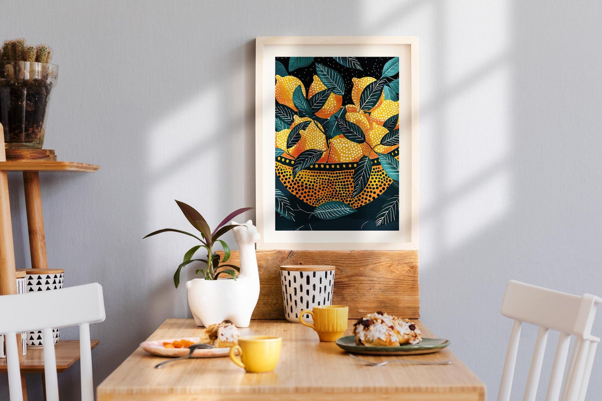 Lemon wall art print with yellow lemons and green leaves above a wooden dining table