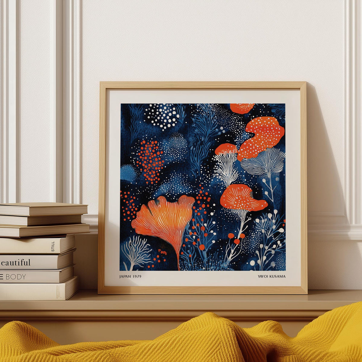 Unique Living Room Wall Art abstract floral shapes in blue and orange framed print close-up on a shelf with books