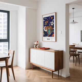 Leopard Galaxy Art Print above a mid century cabinet with a cat figurine in a modern dining room