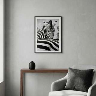 Zebra Black White wall art showing a close-up of zebras in black and white above a wooden console table
