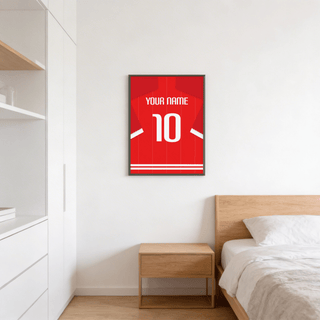 Football Shirt Poster in Red Pinstripe with White Number above wooden bedside table in a bedroom
