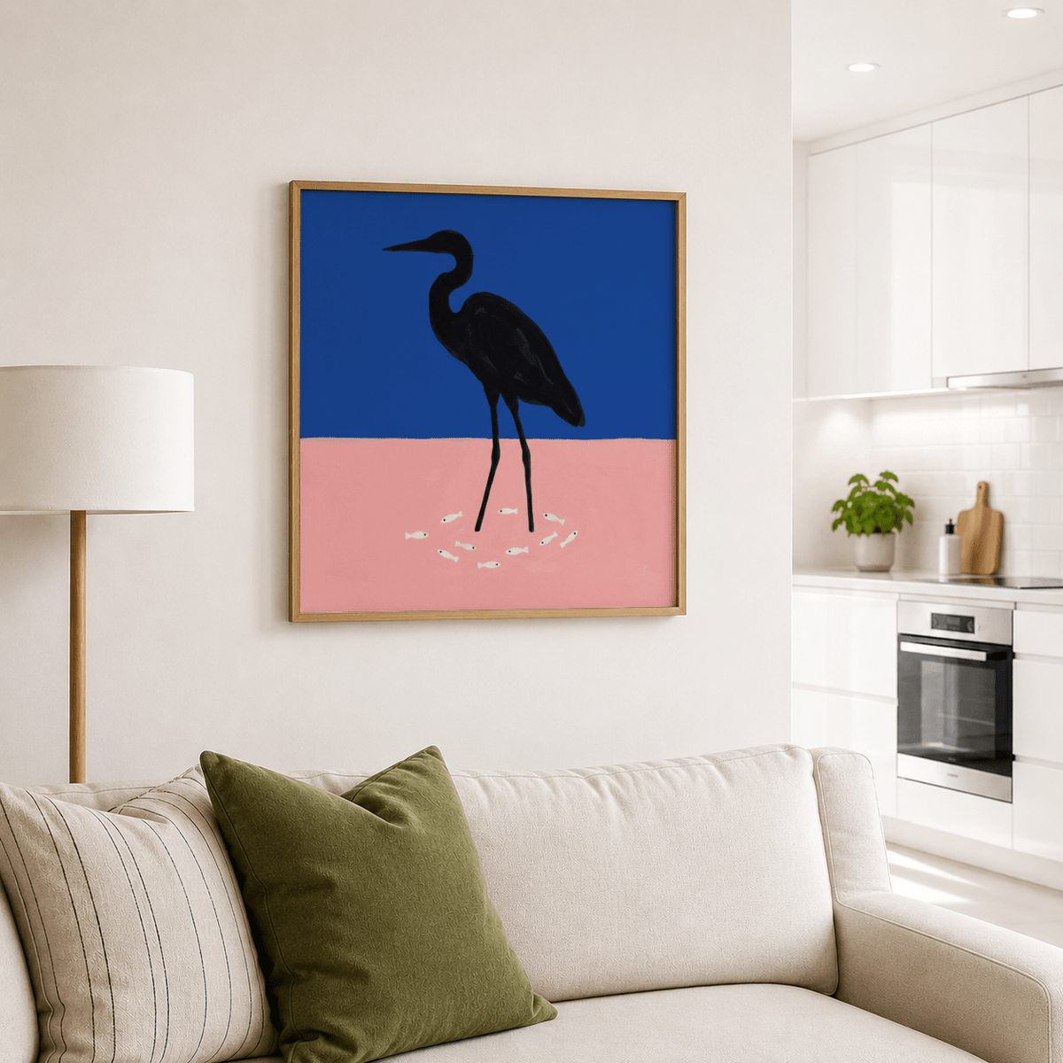 Heron art print with blue and pink minimalist colours above a beige sofa and green cushion