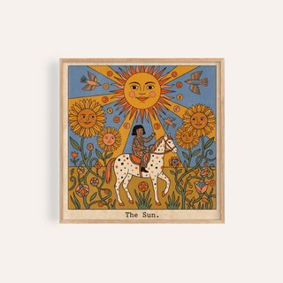 Framed print of The Sun Tarot Card Art showing a child on a spotted horse with sunflowers and birds