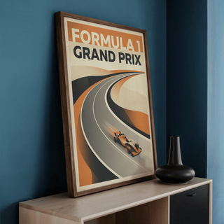Full composition of racing poster print with large text and layered track shapes in orange and black