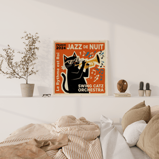 Jazz Cat Art print on a wall above a bed showing a retro black cat playing trumpet with orange background
