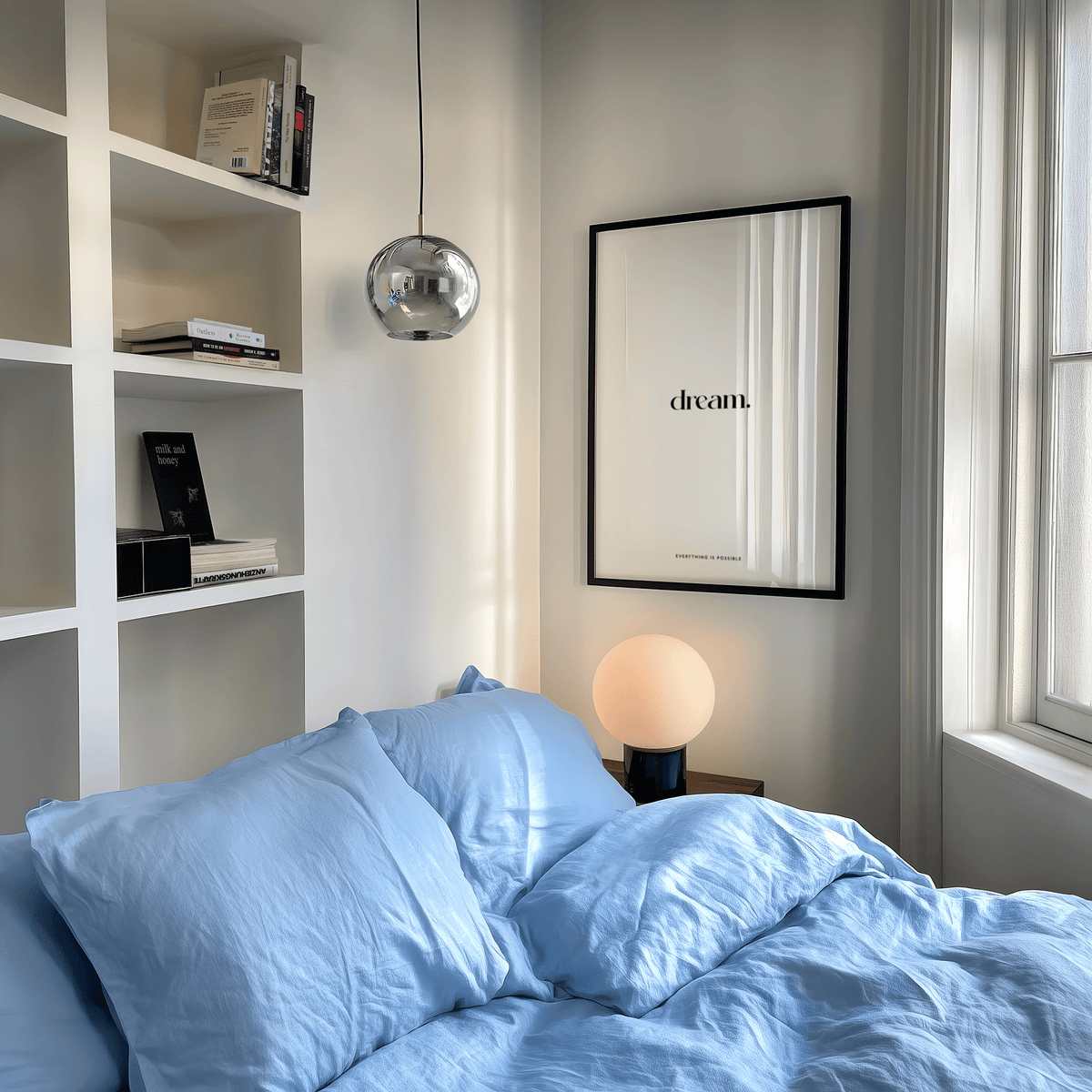 Personalised Quote Poster print on a wall in a bedroom with blue bedding and a round lamp