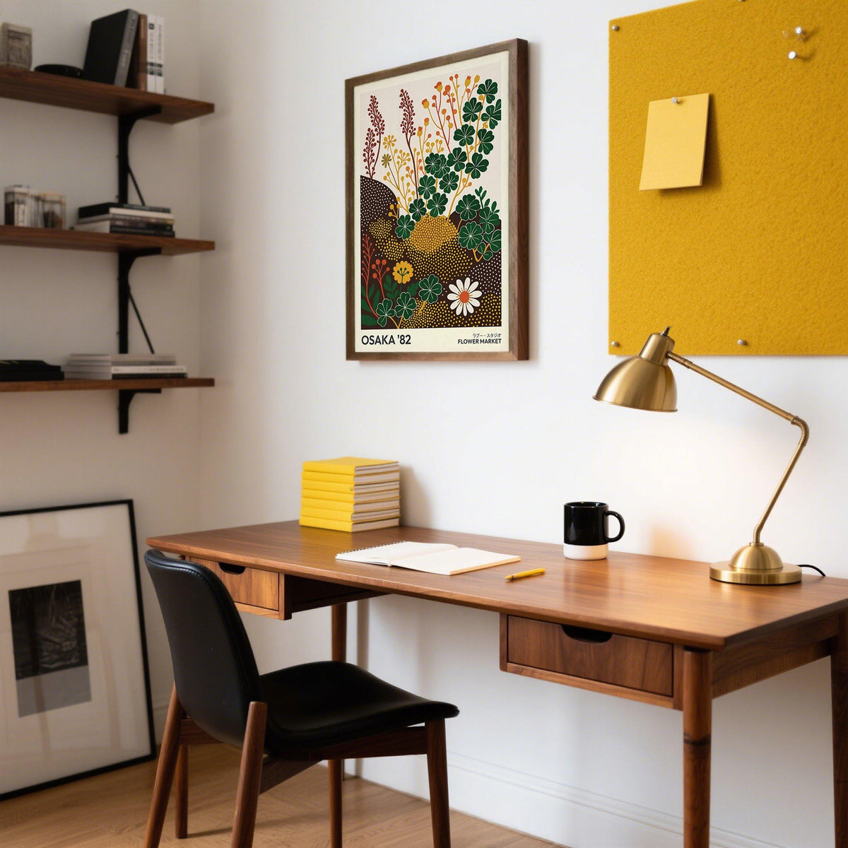 Wildflower Art Prints framed print with green and yellow cloverfield flowers above a wooden desk with a lamp