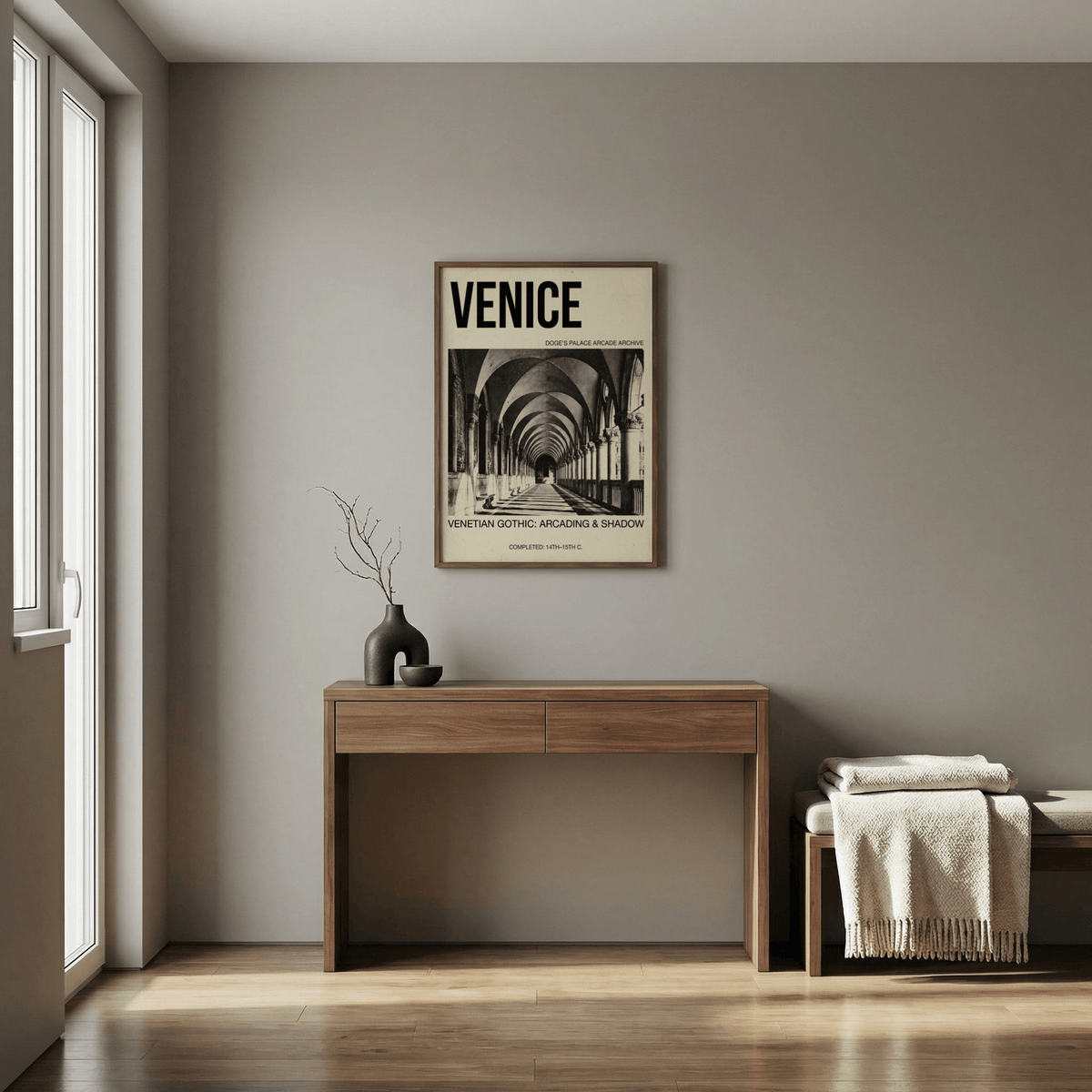 Venetian Gothic wall art of arcade shadows in black and white above a wooden console in a neutral room