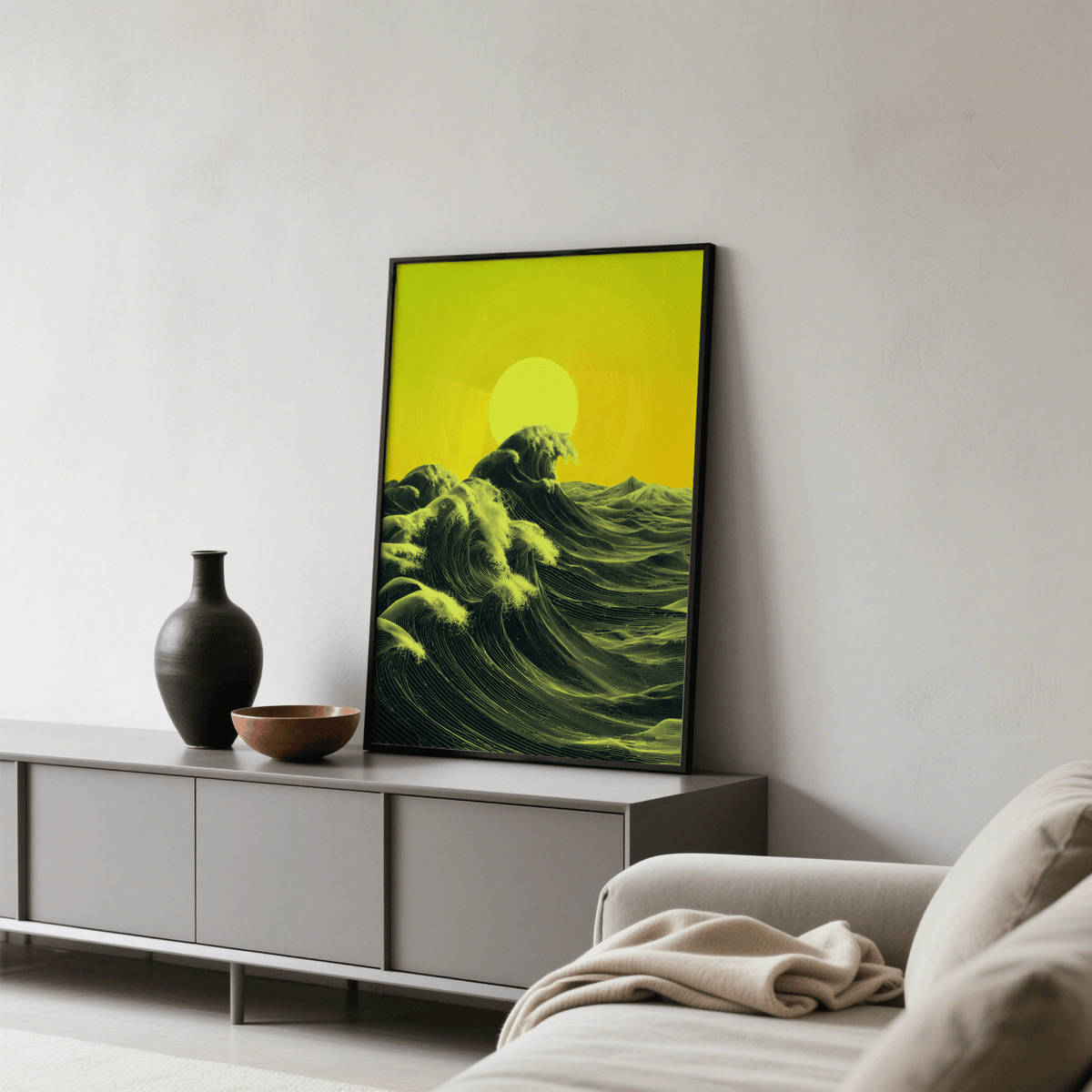 Abstract Ocean Art Print leaning on a grey sideboard with a dark vase and bowl in a living room