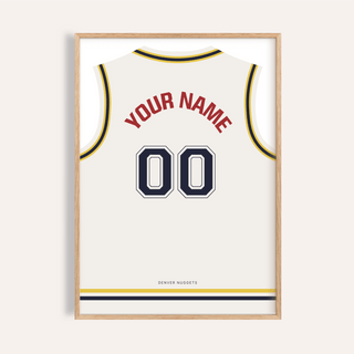 Framed basketball jersey poster in white with yellow and navy trim showing custom name and number