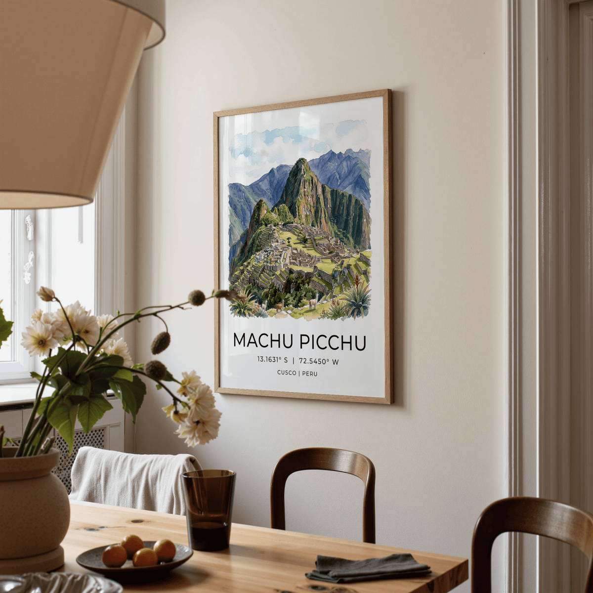 Machu Picchu art print of the ruins in watercolour style above a wooden dining table with chairs